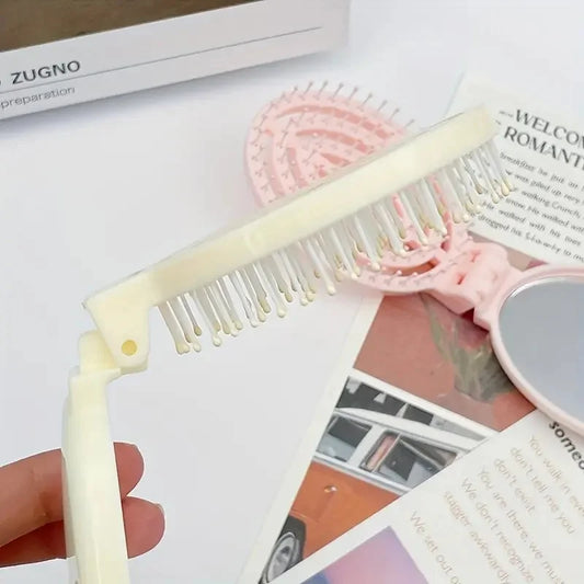Portable Folding Hair Comb with Mirror, Lightweight & Travel-Friendly for On-the-Go Styling. A Perfect Gift for Women & Girls.